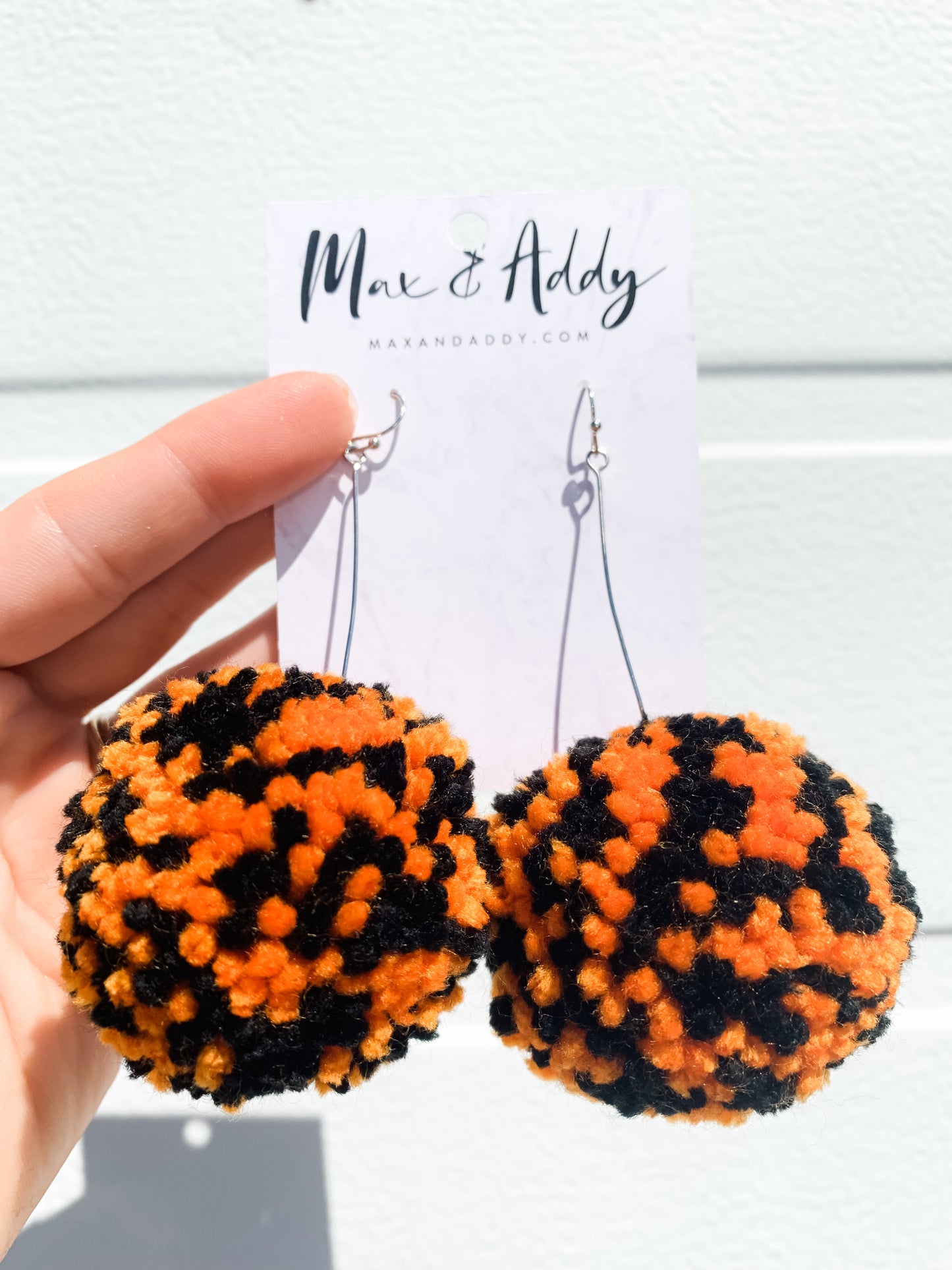 Large Pom Pom Earrings in Orange/Black